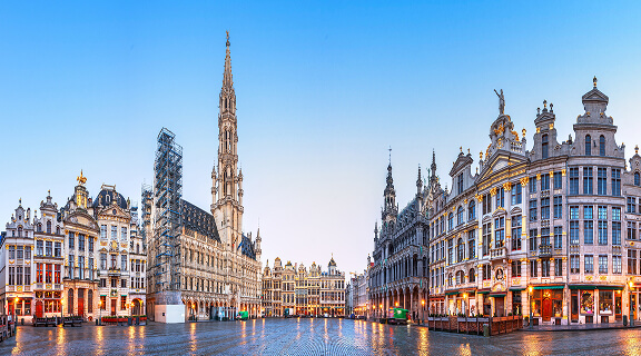 Brussels, Belgium at Grand Place with the Town Hall tower at blue hour.