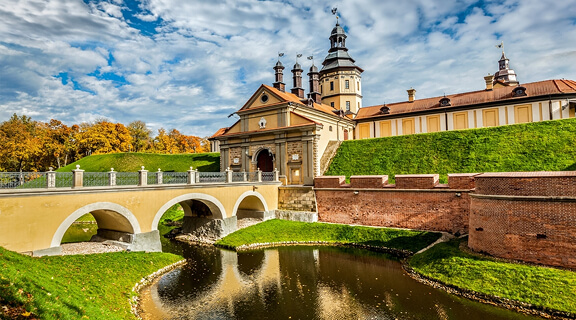 Belarusian tourist landmark attraction Nesvizh Castle - medieval castle in autumn. Nesvizh, Belarus
