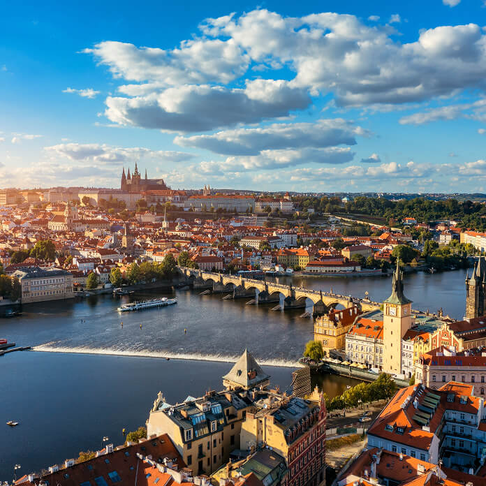 Prague scenic spring aerial view of the Prague Old Town pier architecture Charles Bridge over Vltava river in Prague, Czechia. Old Town of Prague with the Castle in the background, Czech Republic.