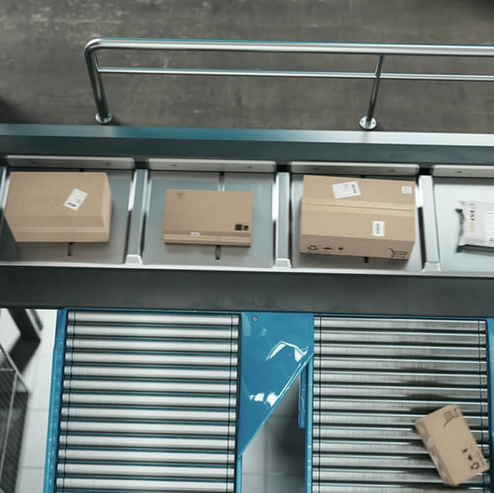 Recyclable Cardboard Box Being Transported on a Conveyor Belt in a Modern Logistics Center. Parcel is Prepared for Delivery to an Online Client. Rendered Conveyor System of a Big Retail Business