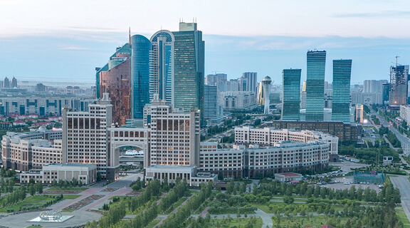 Elevated view over the city center and central business district from day to night transition aerial timelapse rooftop, Central Asia, Nur-Sultan city, Kazakhstan.