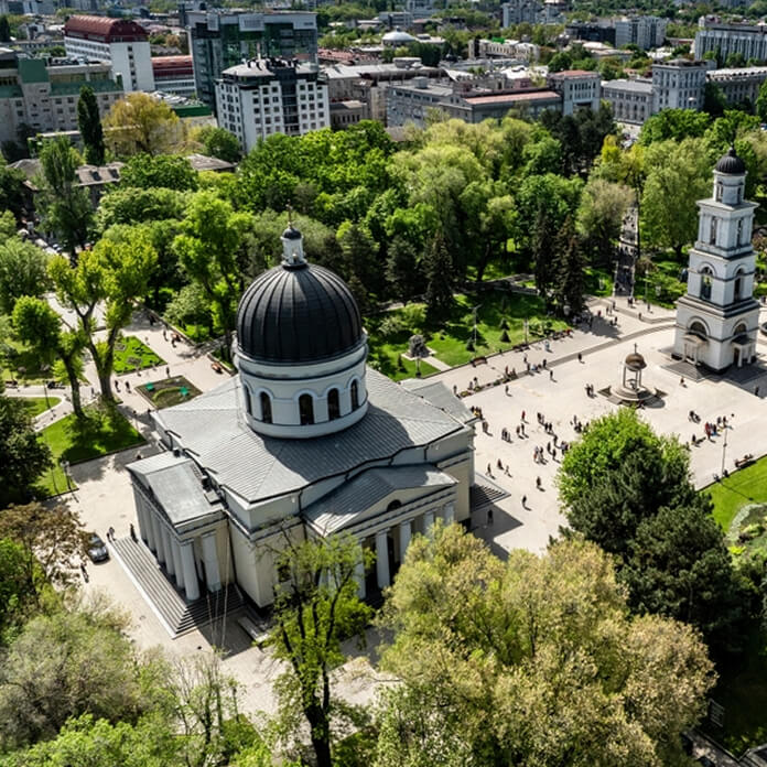 Aerial view of center of city of chisinau with cathedral orthodox church and bell tower with triumph arch and Government of Moldova and Great National Assembly Square during sunny day