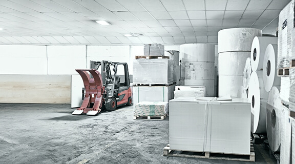 Printing, factory and paper manufacturing in warehouse at production facility, distribution and storage. Workshop, business and service process or newspaper industry with supplier or wholesale stock