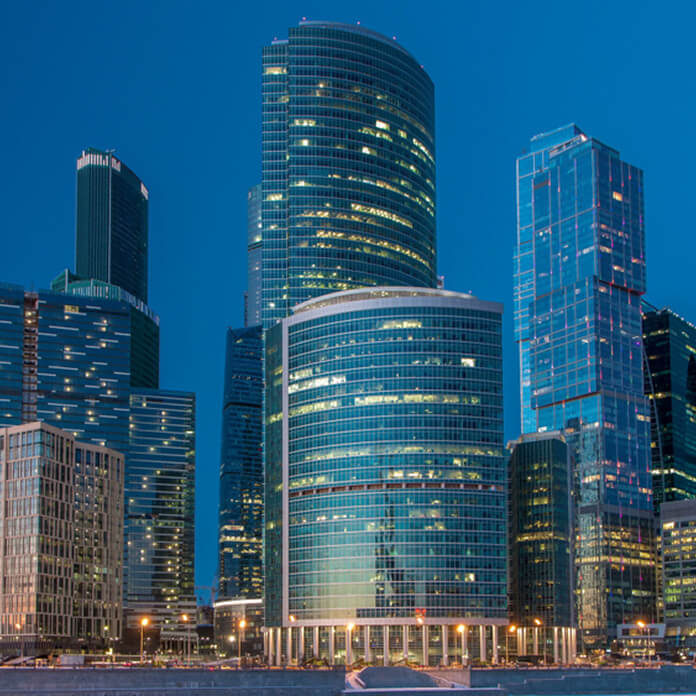 Moscow City in winter day to night transition. International business center and a commercial district after sunset in central Moscow, Russia.