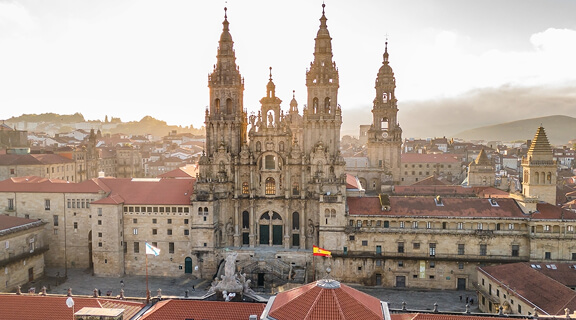 Aerial view of the Cathedral of Santiago de Compostela at sunrise in Galicia, Northern Spain. Renowned Christian pilgrimage site and final destination of the historic Camino de Santiago route.