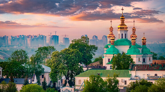 Amazing summer sunrise of Kiev Pechersk Lavra Orthodox Monastery. Impressive morning view of Kiev, capital of Ukraine, Europe. Traveling concept background.